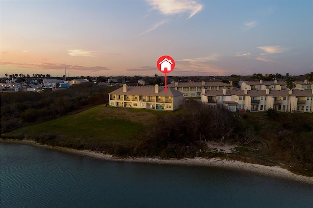 birds eye view of property featuring a residential view and a water view