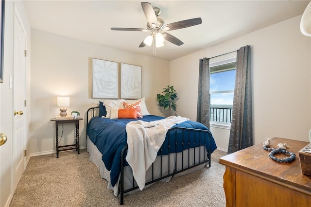 bedroom featuring light carpet, ceiling fan, and baseboards