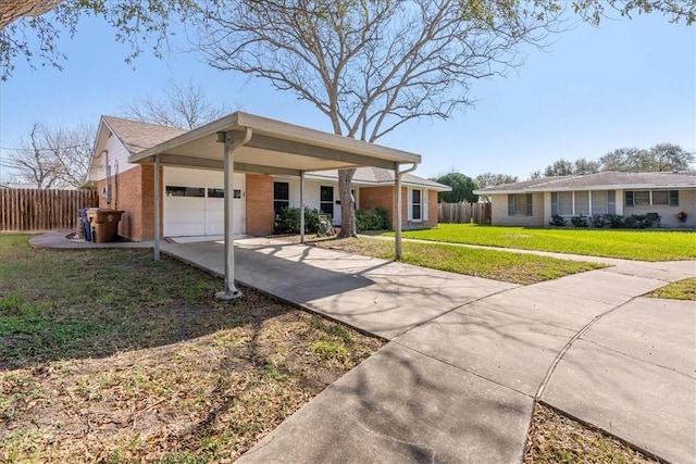 single story home with a front yard, fence, concrete driveway, and brick siding