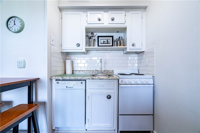 kitchen with decorative backsplash, white cabinetry, white appliances, and sink