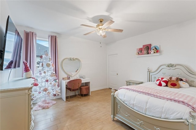 bedroom featuring ceiling fan and light hardwood / wood-style flooring