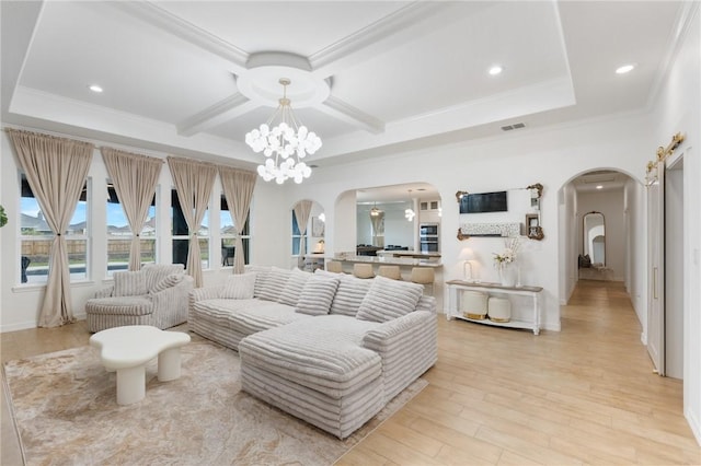 living room with beam ceiling, light hardwood / wood-style floors, crown molding, and an inviting chandelier