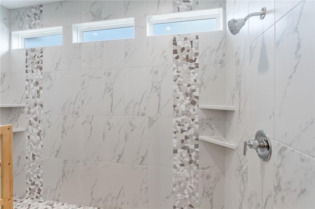 bathroom featuring tiled shower