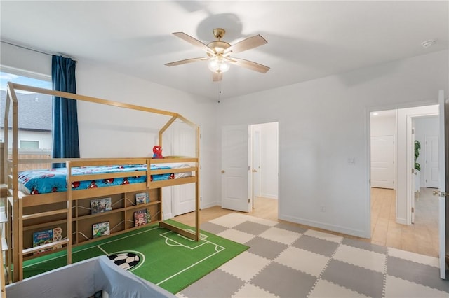 bedroom with hardwood / wood-style flooring and ceiling fan