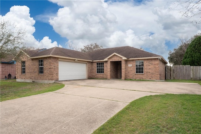 single story home with a garage, concrete driveway, brick siding, and a front yard