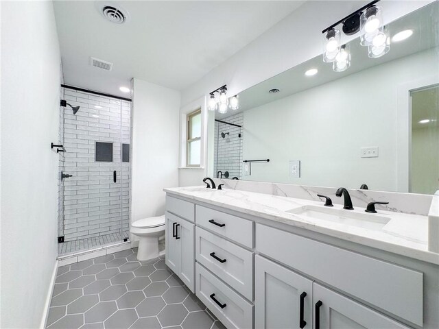 126 Rainbow Ln, Corpus Christi, TX 78411 - bathroom featuring a shower stall, toilet, tile patterned flooring, double vanity, and recessed lighting
