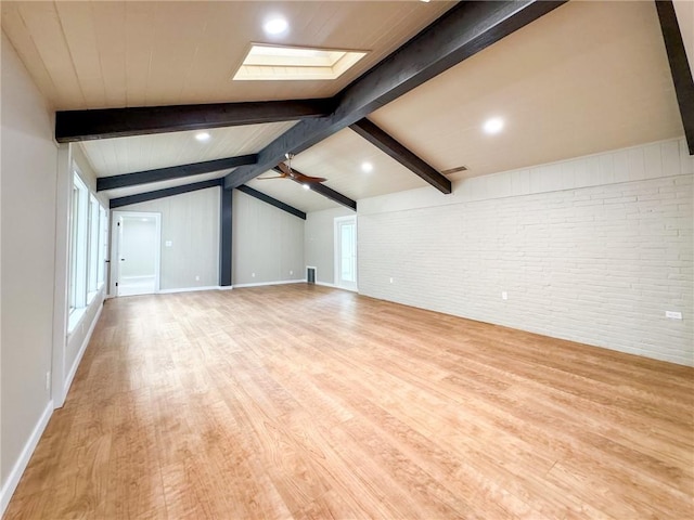 126 Rainbow Ln, Corpus Christi, TX 78411 - additional living space with brick wall, a skylight, wood finished floors, baseboards, and ceiling fan