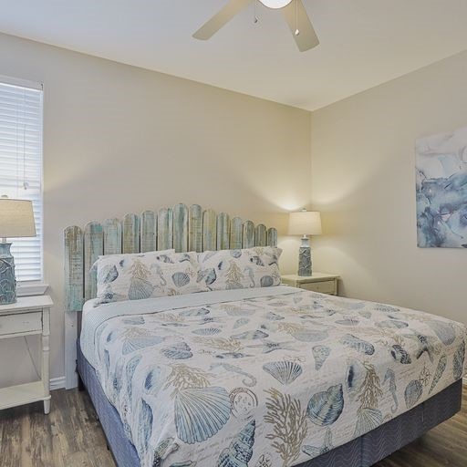 bedroom featuring dark wood-type flooring and ceiling fan