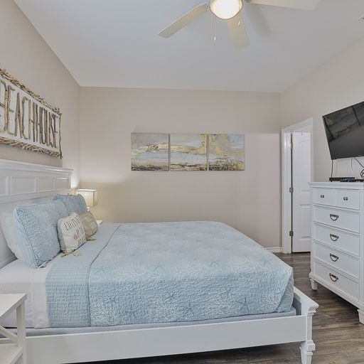 bedroom featuring dark wood-type flooring and ceiling fan