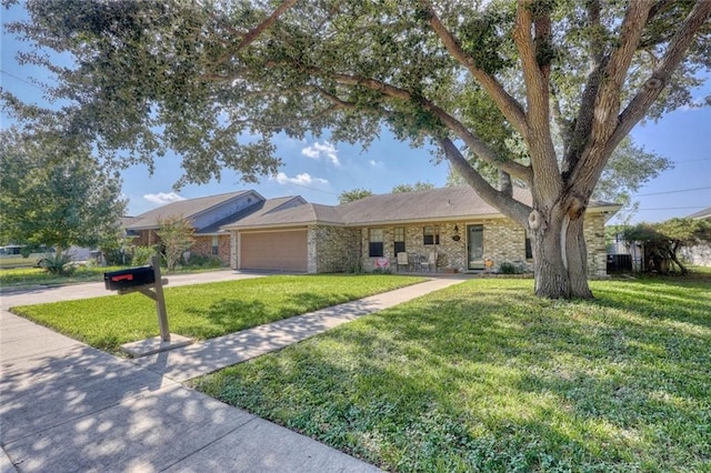 ranch-style home with a garage and a front lawn