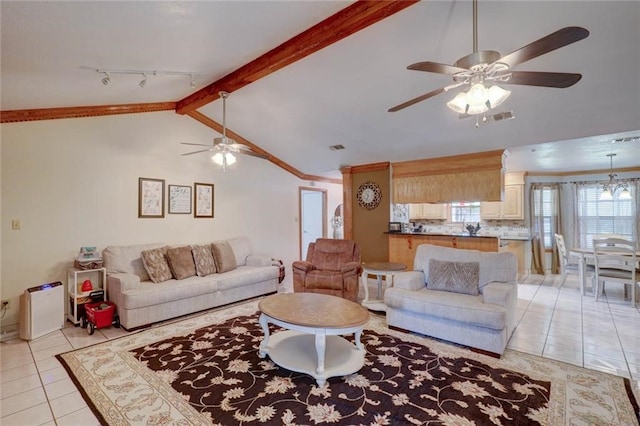 tiled living room featuring ceiling fan with notable chandelier and vaulted ceiling with beams