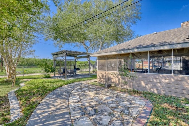 view of patio with a sunroom