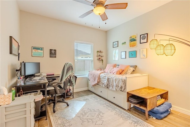 bedroom featuring hardwood / wood-style floors and ceiling fan