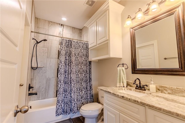 full bathroom with vanity, toilet, and shower / bath combo