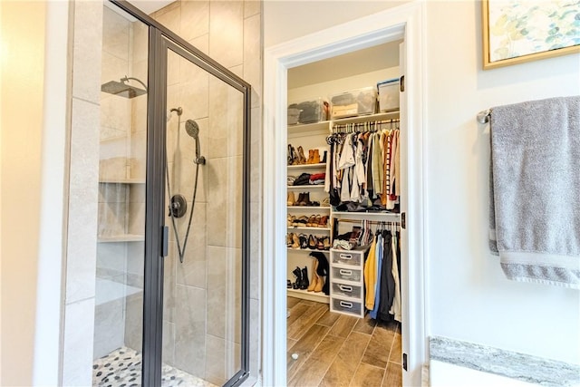 bathroom with a shower with shower door