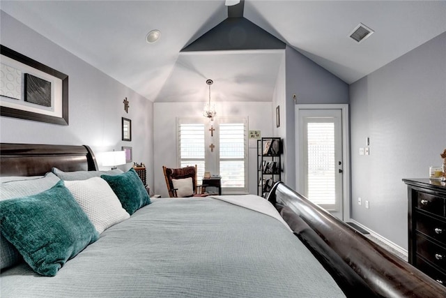 bedroom with baseboards, visible vents, vaulted ceiling, and wood finished floors