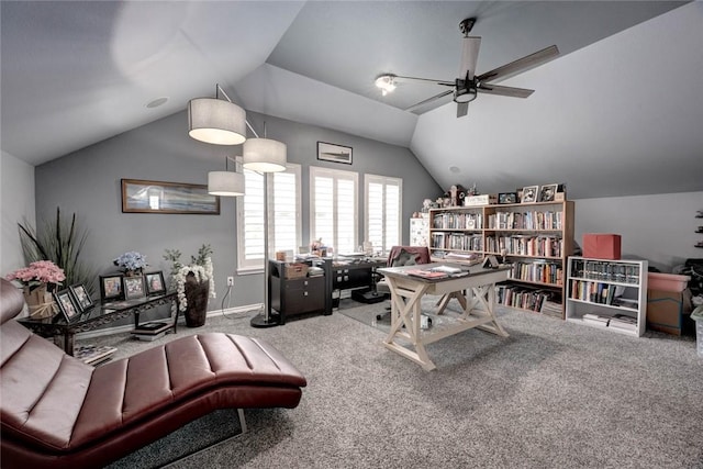 home office with lofted ceiling, carpet floors, ceiling fan, and baseboards