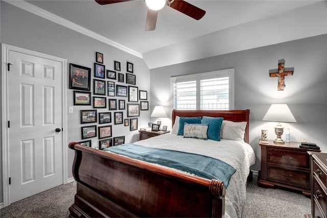 bedroom with carpet floors, ornamental molding, a ceiling fan, and lofted ceiling