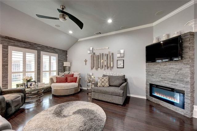 living area with crown molding, a fireplace, vaulted ceiling, wood finished floors, and baseboards