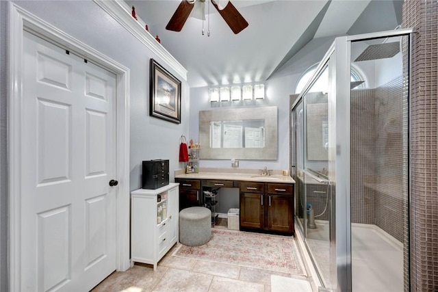 full bathroom featuring tile patterned floors, a shower stall, a ceiling fan, and vanity