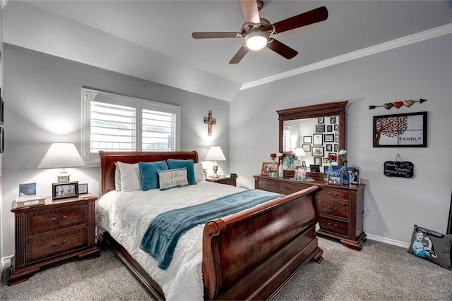 bedroom featuring carpet floors, crown molding, lofted ceiling, a ceiling fan, and baseboards