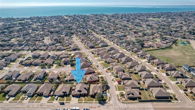 birds eye view of property featuring a residential view and a water view