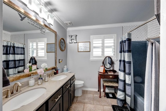 full bath with a shower with curtain, ornamental molding, and a sink