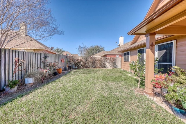 view of yard featuring a fenced backyard