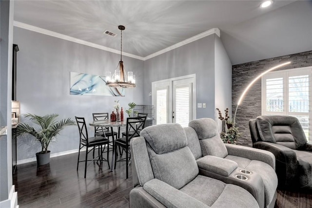 dining space featuring a wealth of natural light, ornamental molding, wood finished floors, and visible vents