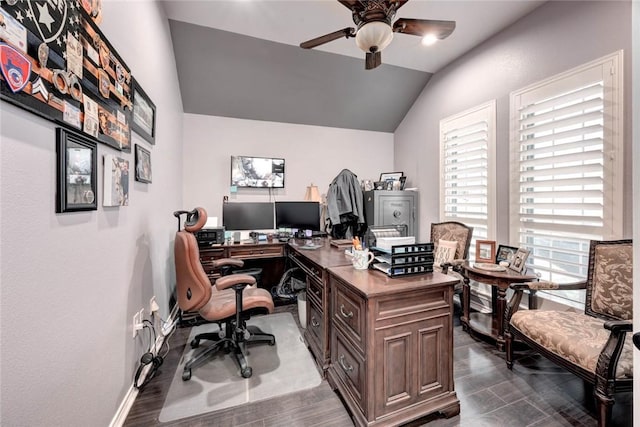 office space with lofted ceiling, ceiling fan, dark wood finished floors, and baseboards