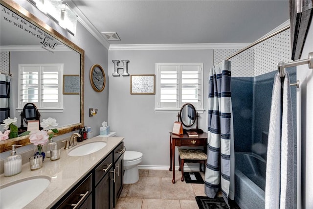 bathroom featuring double vanity, visible vents, toilet, crown molding, and a sink