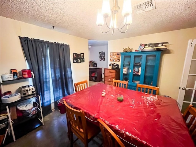 4321 Woodland Creek Dr, Corpus Christi, TX 78410 - dining area with a chandelier, finished concrete flooring, and a textured ceiling
