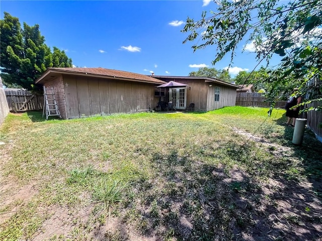 4321 Woodland Creek Dr, Corpus Christi, TX 78410 - rear view of house featuring french doors and board and batten siding