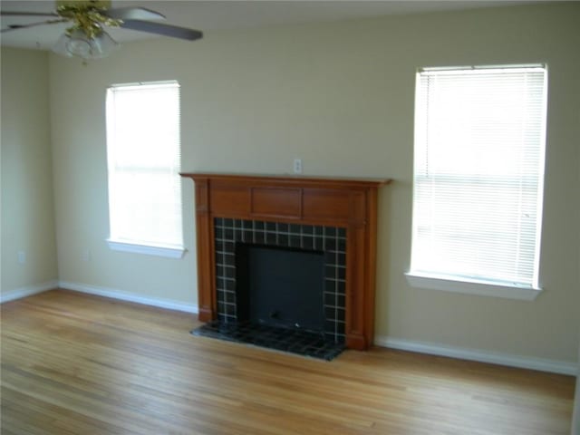 822 Indiana Ave, Corpus Christi, TX 78404 - unfurnished living room featuring baseboards, a ceiling fan, and light wood-type flooring