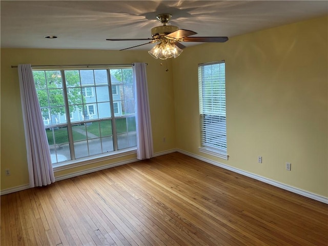 822 Indiana Ave, Corpus Christi, TX 78404 - empty room with baseboards, a wealth of natural light, ceiling fan, and wood-type flooring
