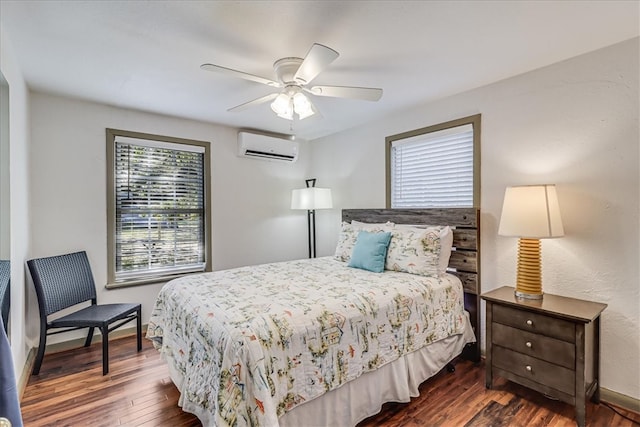 bedroom featuring a wall mounted air conditioner, ceiling fan, and dark hardwood / wood-style floors