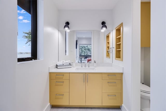 bathroom with vanity and toilet