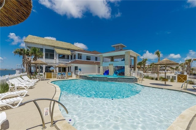 pool featuring a patio area and fence