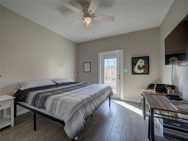 bedroom featuring access to outside, ceiling fan, baseboards, and wood finished floors