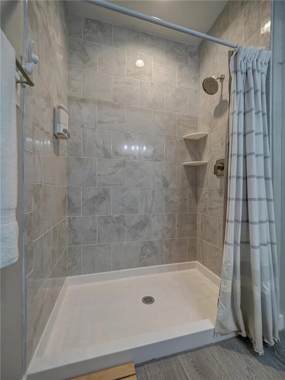 bathroom featuring a shower stall