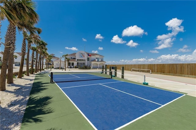 view of tennis court with fence