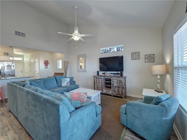 living room featuring high vaulted ceiling, hardwood / wood-style flooring, and ceiling fan