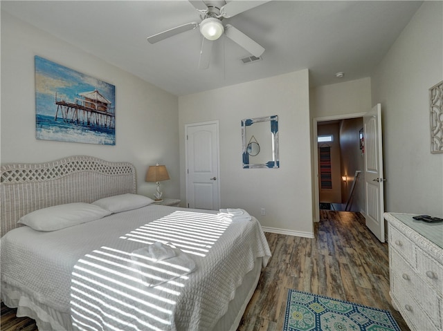 bedroom featuring dark wood-type flooring and ceiling fan