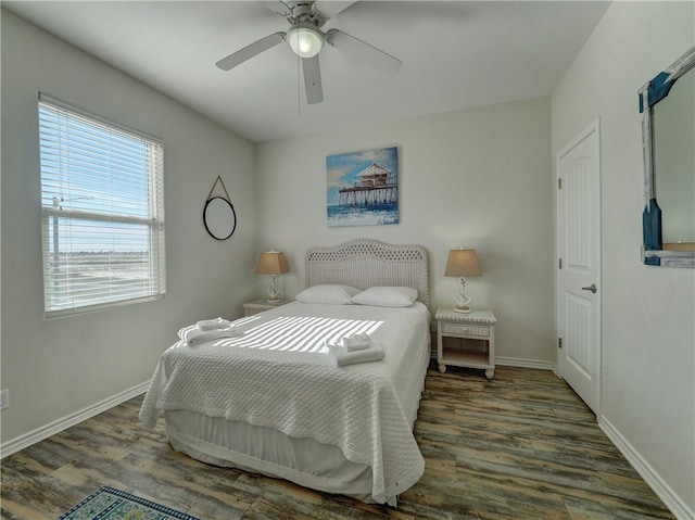 bedroom featuring ceiling fan and dark hardwood / wood-style floors