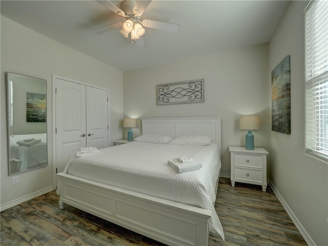 bedroom with a closet, ceiling fan, and dark hardwood / wood-style floors