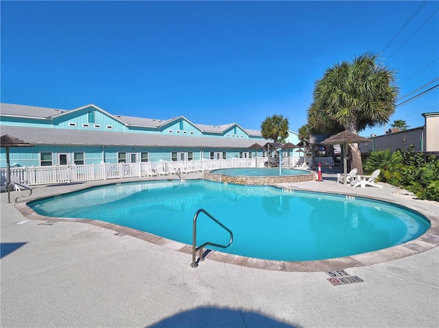 view of swimming pool featuring a patio