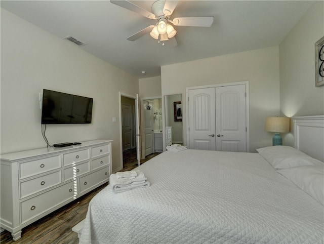 bedroom with ceiling fan, a closet, and dark hardwood / wood-style flooring