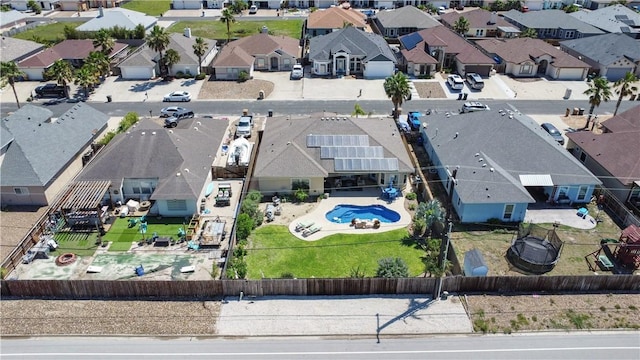aerial view of residential area featuring a pool area