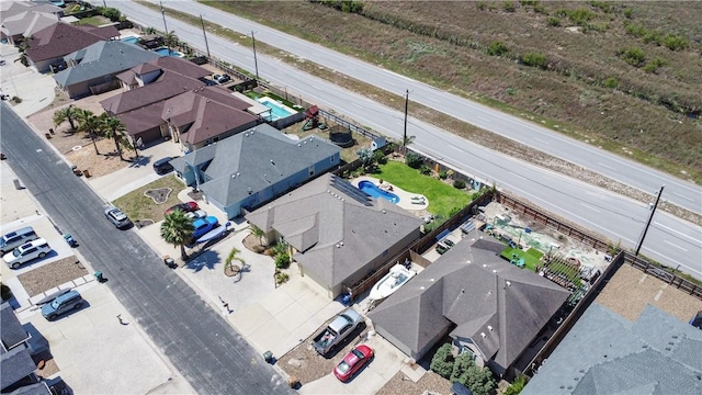 aerial view of residential area featuring a pool