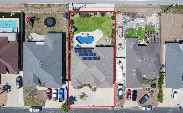 aerial overview of property's location with property parcel outlined and a pool area